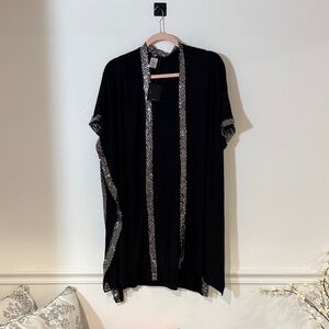 Elegant Black Cape with Patterned Trim